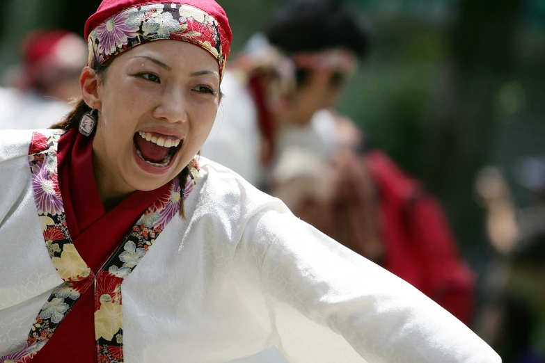 a woman dressed in white and colorful clothes