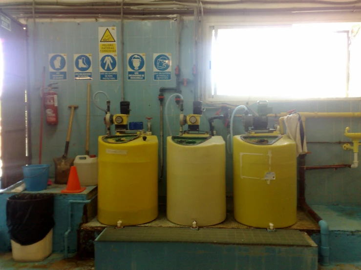 yellow gas tanks in an industrial setting