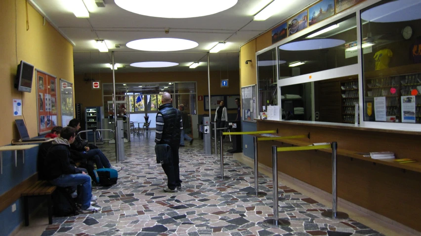 an image of a man walking down a hallway