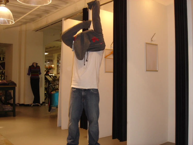 a person holds his arms up in the air while using a phone