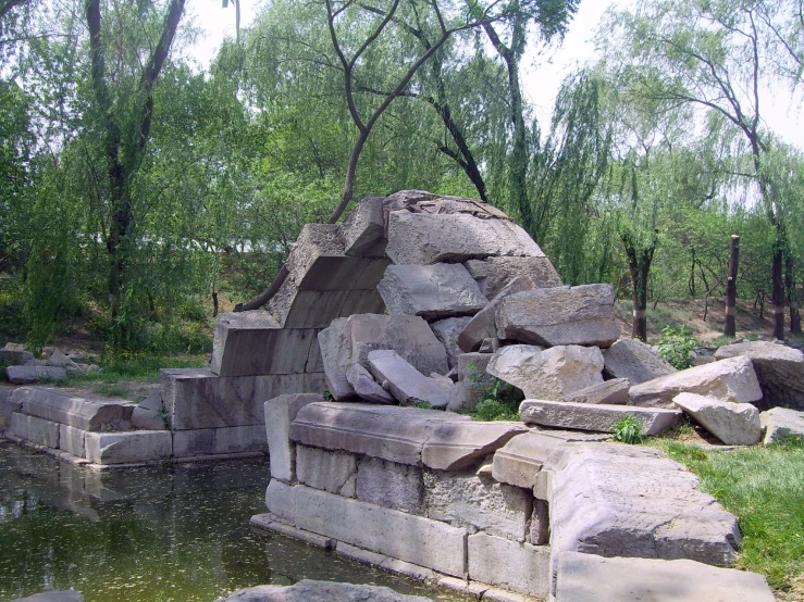 stone benches on the side of the river