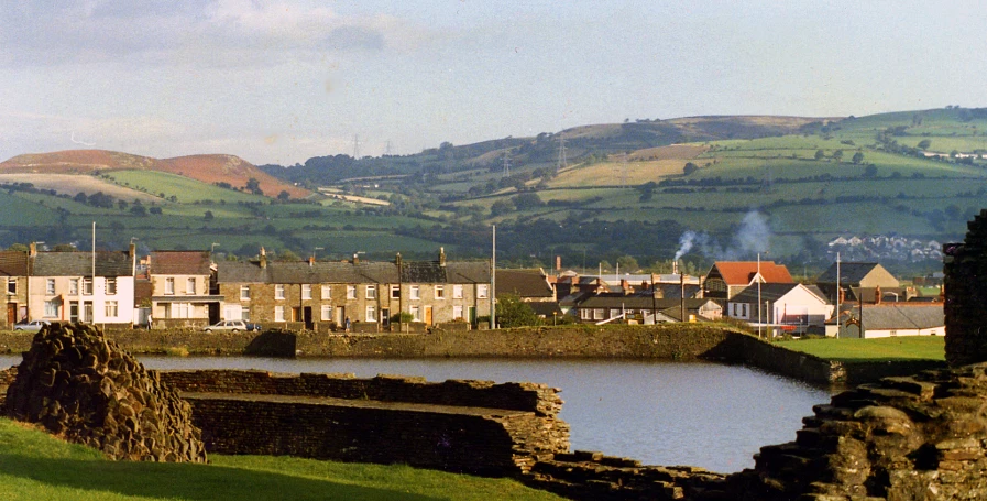 the town is surrounded by mountains on the other side of a river