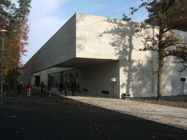 people walking near a building on a street