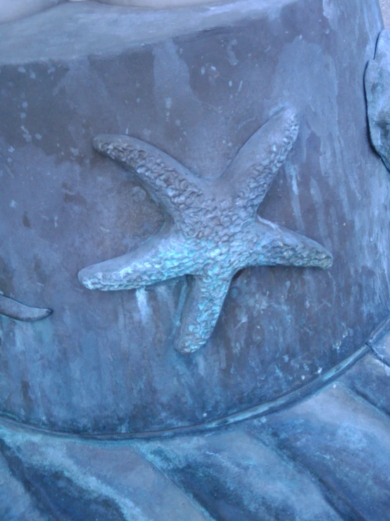 the statue has a starfish carved on it