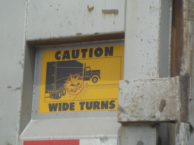 a sign that reads caution, wilde turns is in an iron door