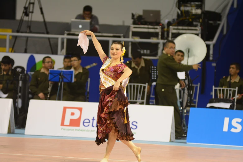 a woman is standing on a court wearing a costume