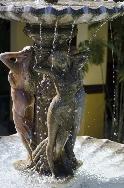 the water fall off the fountain that looks like birds