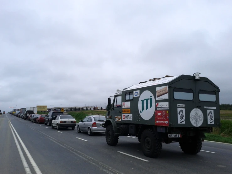 a large army vehicle driving down the road