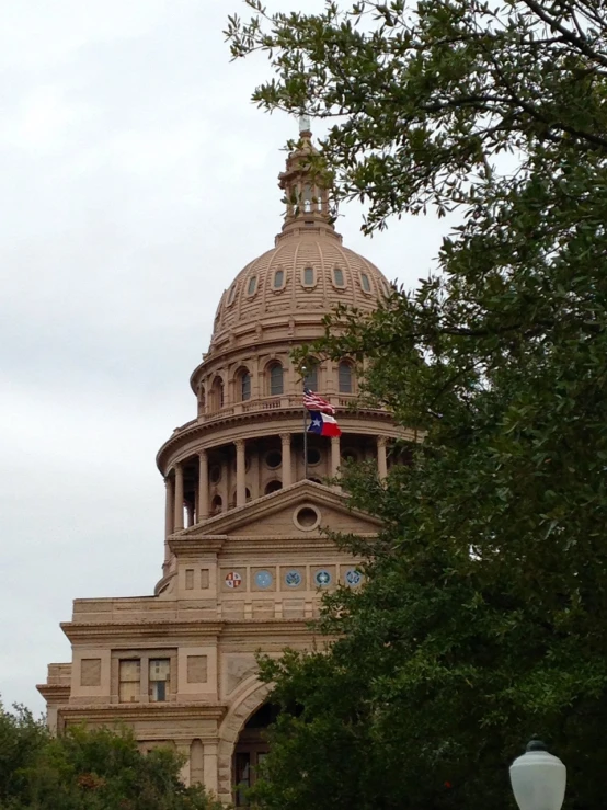 a building with a dome and a flag on top