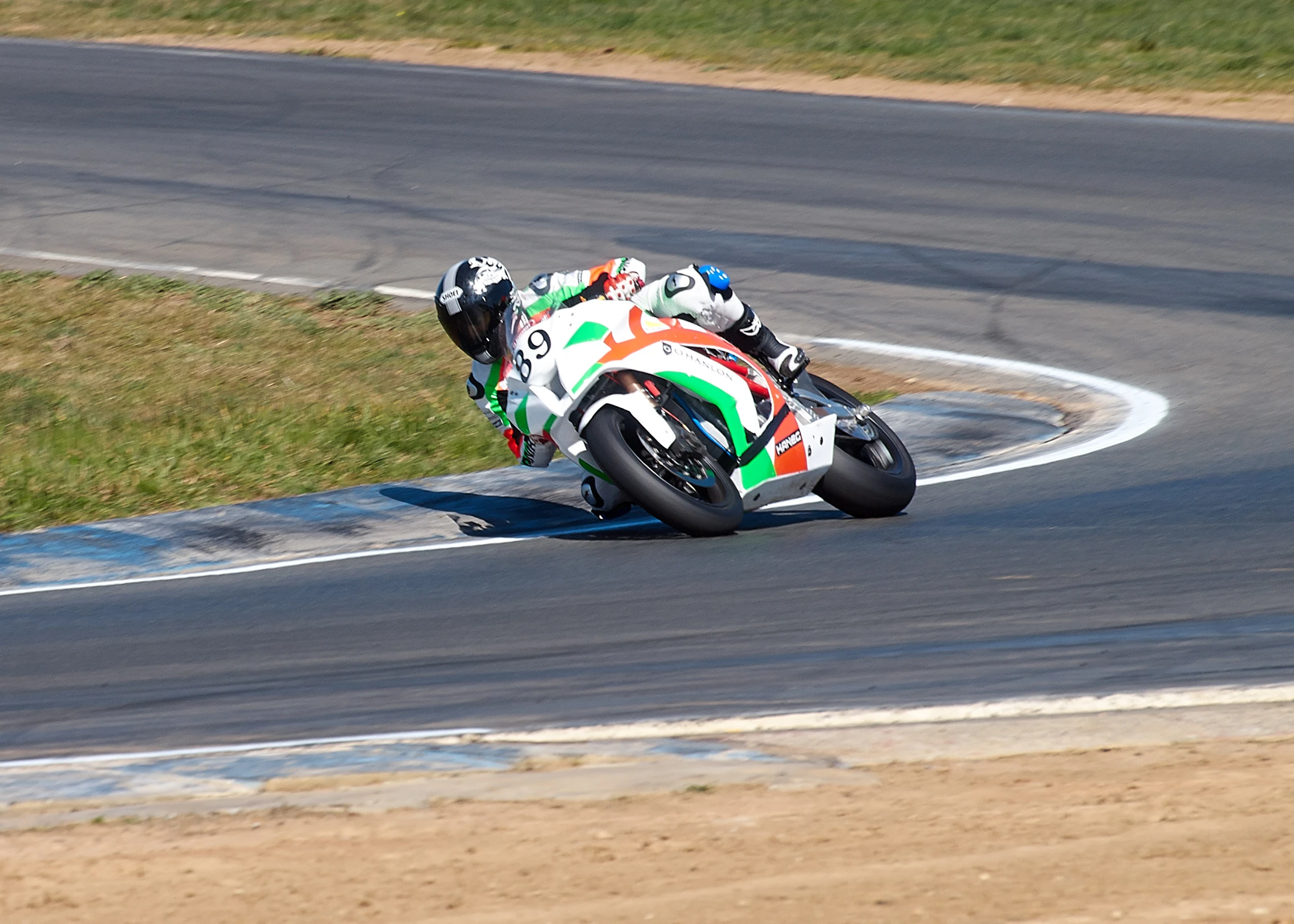 motorcycle race racer turning the road on his bike