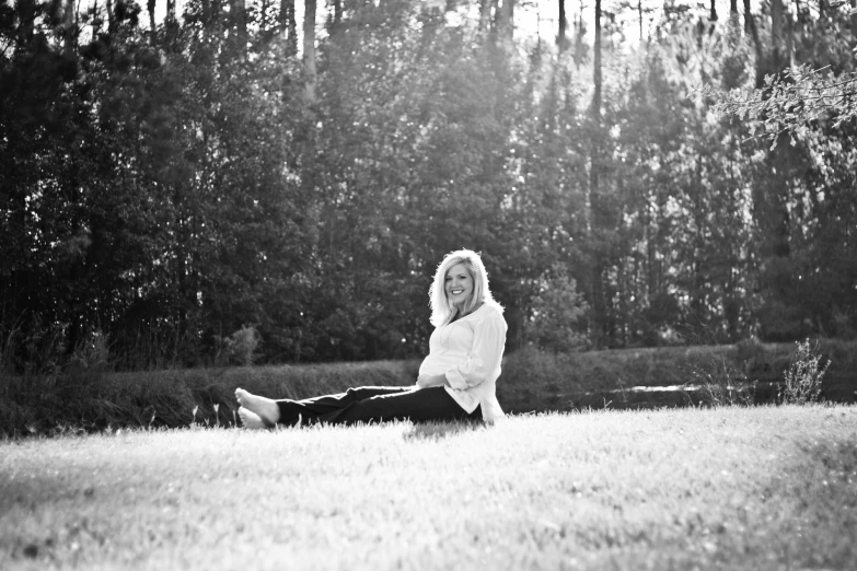 black and white pograph of a young woman on the ground