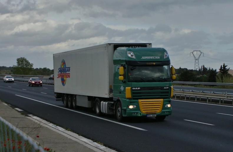 a big rig semi truck driving on the freeway