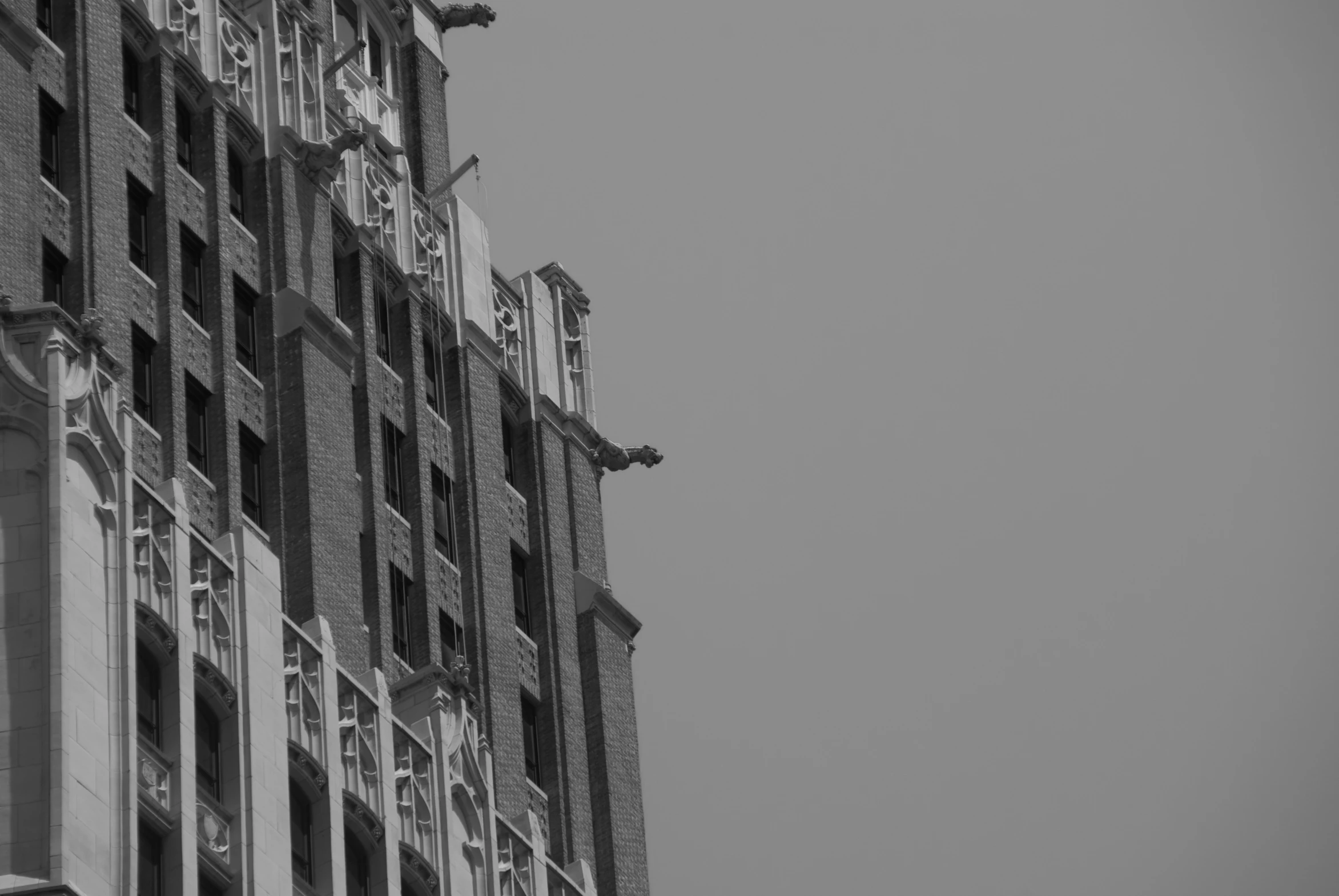 a black and white image of the top of a tall building