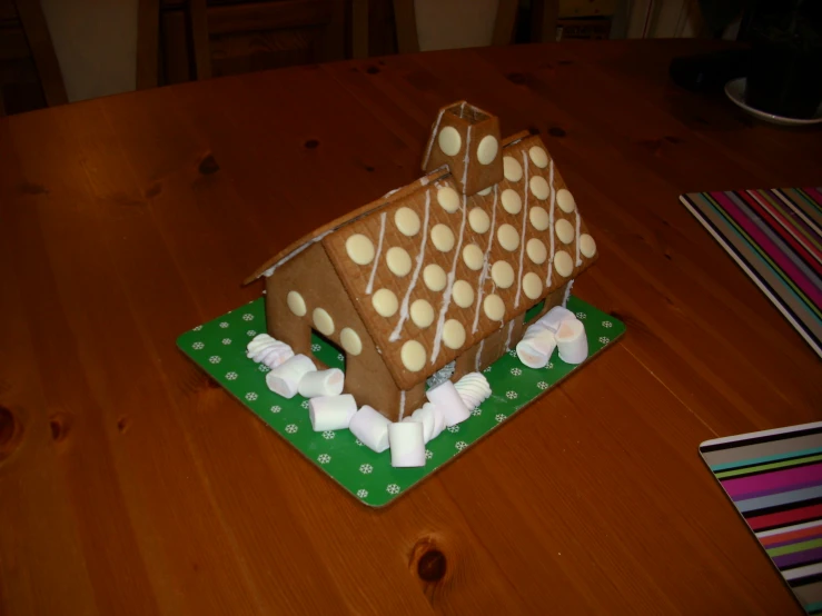 a table with a cake in the shape of a boat