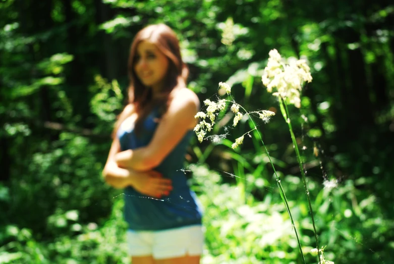 a women that is standing in the grass