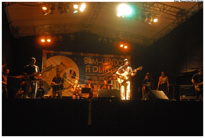 an audience watches a band on stage