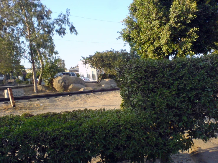 a view of a train track from across the yard