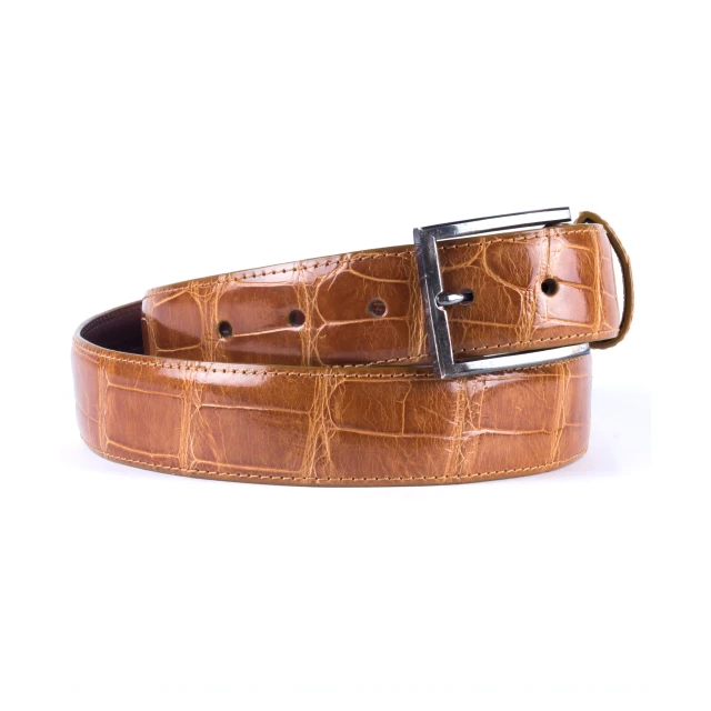 the leather belt is made with brown crocodile emboshing