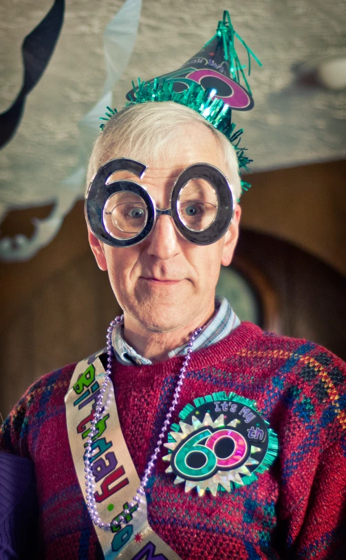 a woman wearing a party hat and goggles