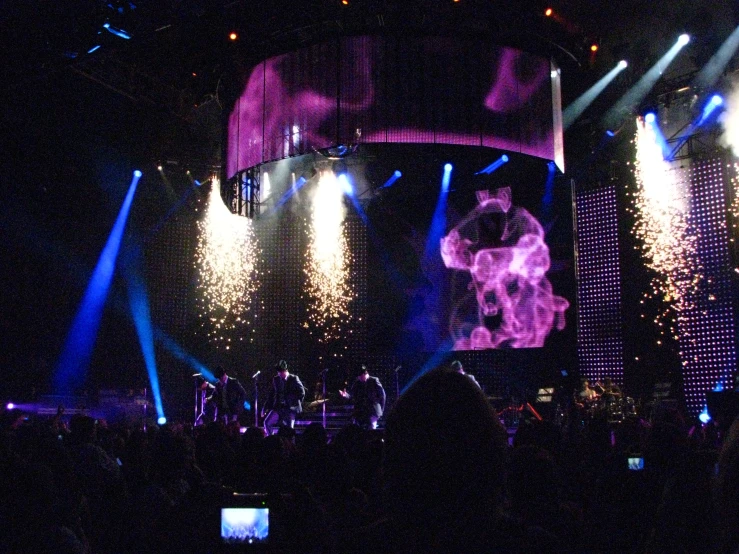 some lights are shining on stage with colorful lights