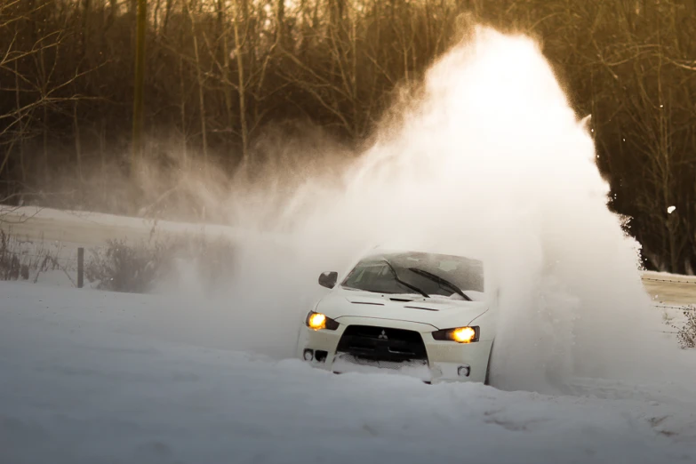 a white car blowing out smoke into the air