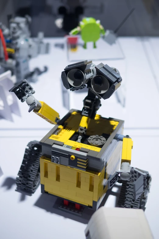 a lego robot set in yellow and black