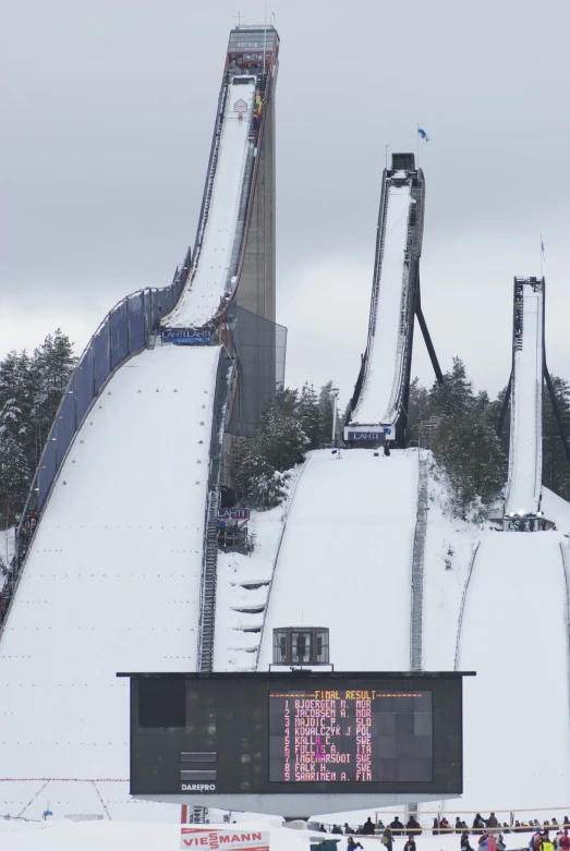 a ski slope with a few people riding it