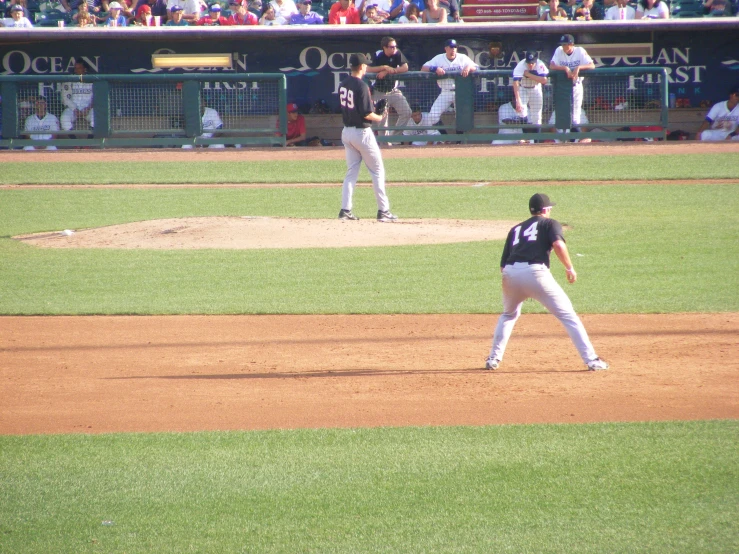 a baseball player holding a bat next to home plate