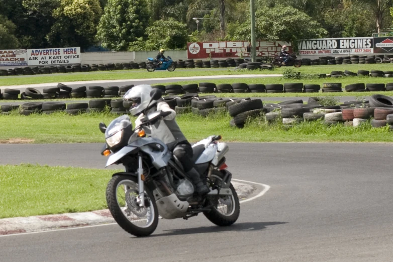 a motorcyclist is driving on a racetrack track