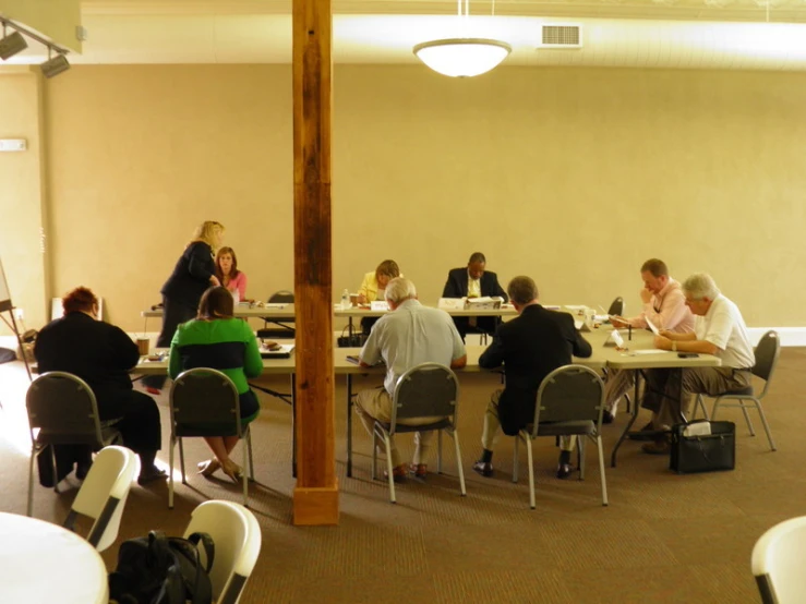 a group of people sitting around a table