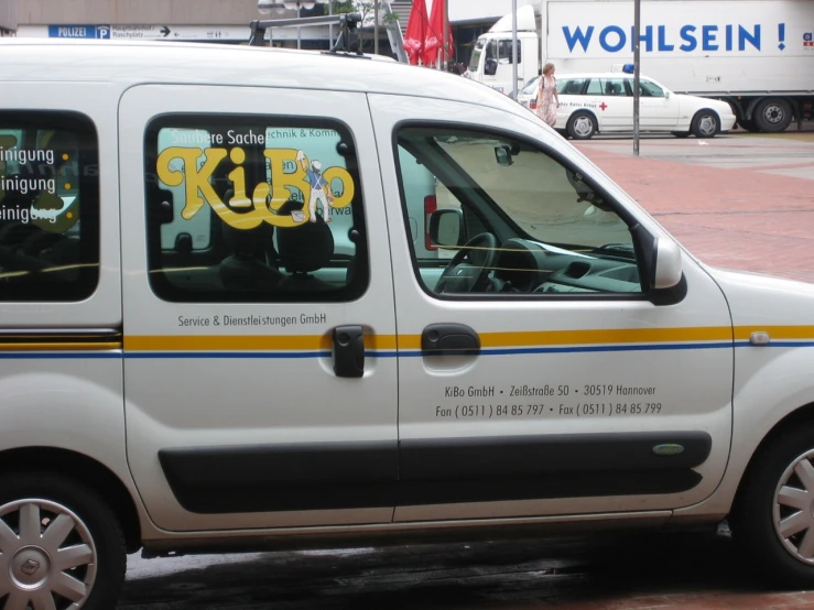 the small van has been decorated with letters