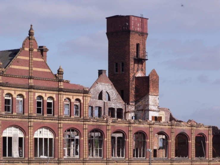 a tall clock tower towering over an old building