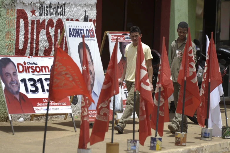 flags with posters and signs that show the political process