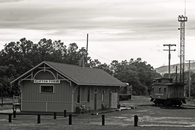 a train sits on the tracks in front of a building