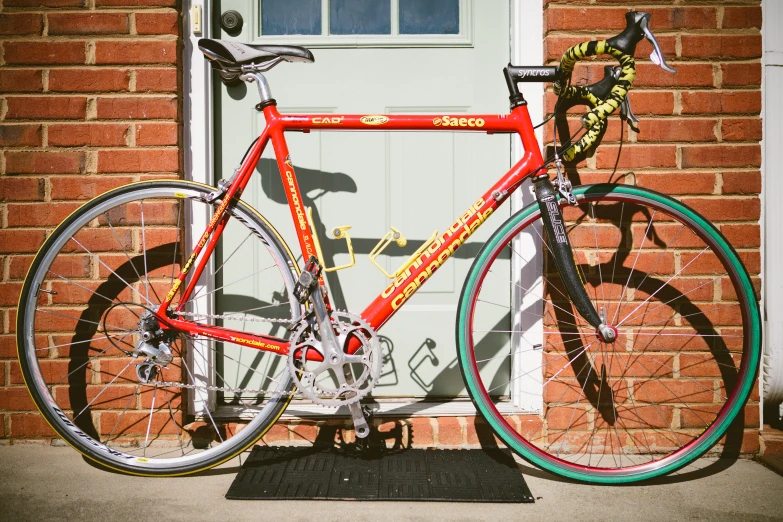 a bike leaning up against a brick building