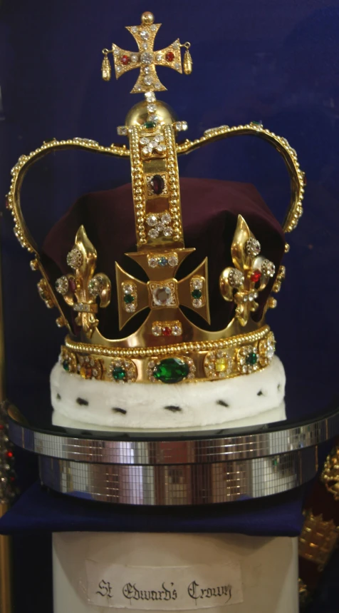 a close up of a gold crown with diamonds