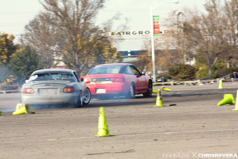 a pair of cars drift off into the air