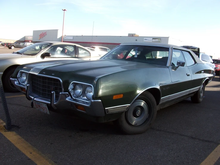 two cars that are parked in a parking lot