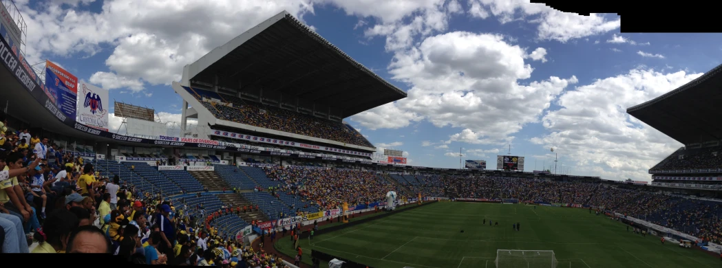 a soccer field with a bunch of people watching