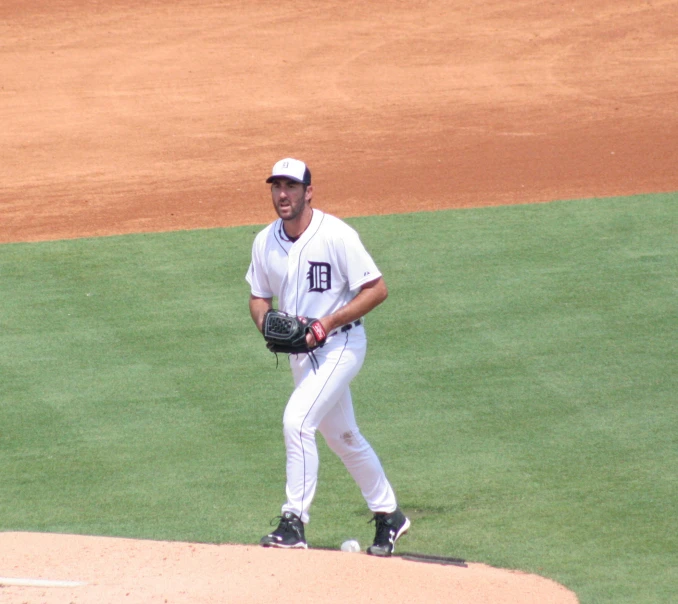 a baseball player stands on the mound