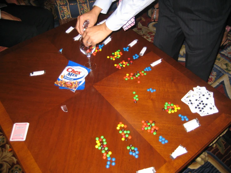 two men are playing with a game on the wooden table
