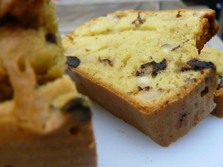 slices of cake on a white plate with a knife