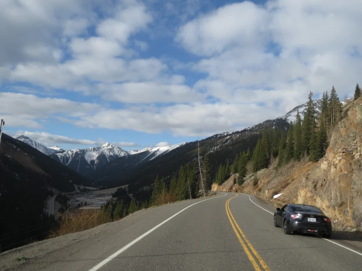 a car on a mountain highway that is empty