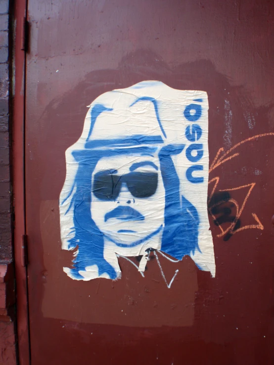 a sticker of a man wearing sunglasses and a hat with a hat on