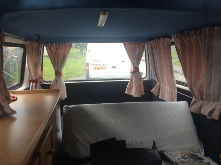 the interior of a camper van with the door open