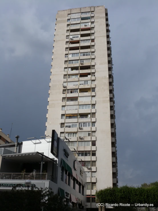 a high rise building that has balconies on the windows