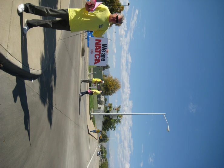 there are people outside in the street flying kites