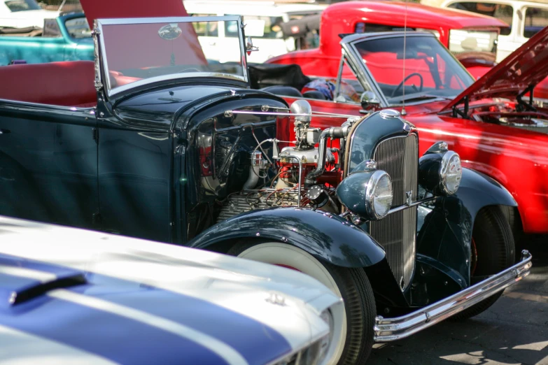 a vintage car is shown on a parking lot