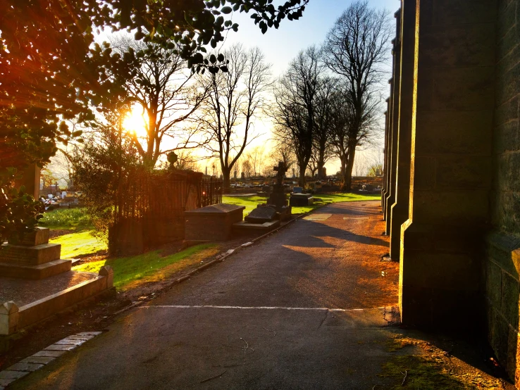 an open doorway in a cemetery on a sunny day