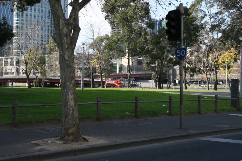 a couple of signs are sitting near the road